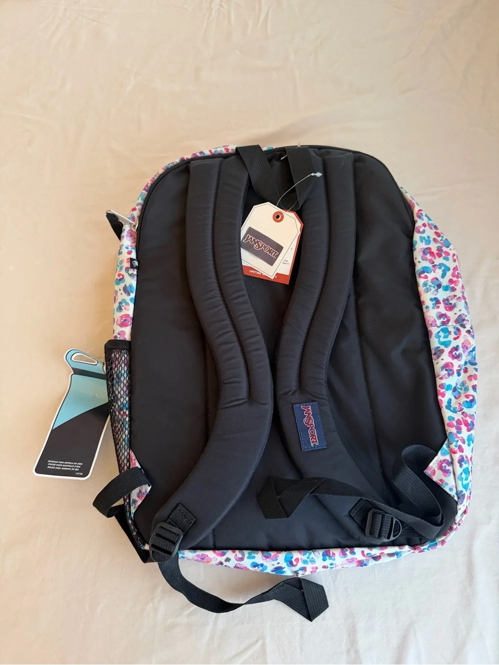 JanSport Backpack in White with Pink & Blue Leopard Print